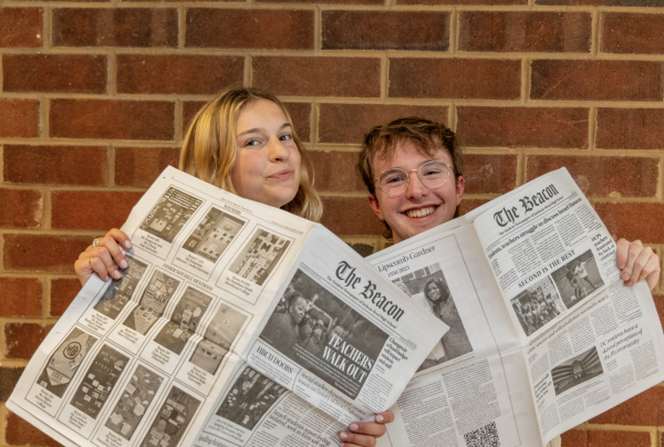 CHEERIO, CHIEFS! - Becca and Simon pose with two Beacon editions from their time as Editors-in-Chief. After a tumultuous tenure, the two plan to use the lessons they have learned to their advantage during this next chapter.